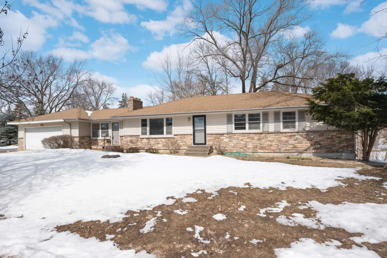 Existing Cedar Crest home in winter, before the proposed landscaping